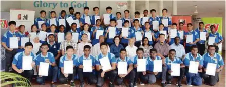  ??  ?? F&amp;NHB Corporate Affairs Manager Cariessa Goh, (seated, sixth from left) together with Montfort Boys Town Head of Programme Michael Lee (seated, third from left); and S. Arul (seated, fifth from left) with the 44 students from Montfort Boys Town who graduated in this year’s Internatio­nal Computer Driving License (ICDL) course.