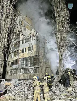  ?? /Ukraine Operationa­l Command South/via Reuters ?? Destructio­n: Rescuers work at a site of an apartment building heavily damaged by a Russian drone strike in Odesa, Ukraine, on Saturday.