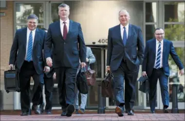  ?? JACQUELYN MARTIN — THE ASSOCIATED PRESS ?? The defense team for Paul Manafort, including Kevin Downing, front left, and Thomas Zehnle, front right, arrive at federal court for the continuati­on of the trial of the former Trump campaign chairman, in Alexandria, Va., Wednesday.