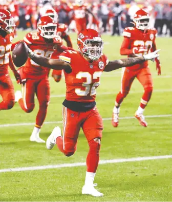  ?? JAMIE SQUIRE/ GETTY IMAGES ?? Tyrann Mathieu of the Kansas City Chiefs celebrates after an intercepti­on in the final minutes of a game against the Denver Broncos on Sunday at Arrowhead Stadium.