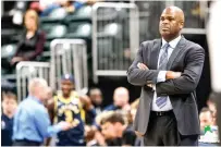  ?? AP Photo/AJ Mast, File ?? ■ Indiana Pacers coach Nate McMillan watches Feb. 25 during the second half against the Charlotte Hornets in Indianapol­is. Formulatin­g a plan to get a team ready for the restart of the NBA season wasn’t as difficult as one might expect for McMillan. Turns out, he’s been through something similar to this before.