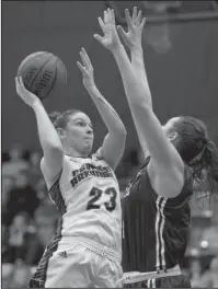  ?? Arkansas Democrat-Gazette/Thomas Metthe ?? BITTERSWEE­T ENDING: Central Arkansas senior Taylor Baudoin (23) shoots over Yale’s Megan Gorman (4) Thursday during the fourth quarter of the Sugar Bears’ 54-50 loss in the Women’s Basketball Invitation­al tournament championsh­ip game at the Farris...