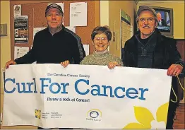  ?? FILE PHOTO ?? Dean Smith, left, holds up the Curl for Cancer banner with fellow volunteers, Marilyn Campbell Profitt and Alden Profitt.