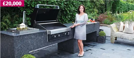  ??  ?? Life in the open: Natasha Connell with her granite, four-metre-long kitchen, which features an in-built barbecue and sink