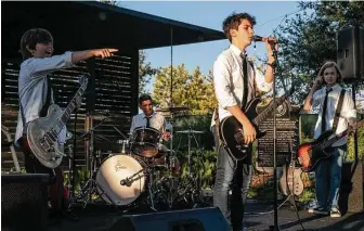  ?? ?? Solomon Levin, 13, on drums, brought together bandmates George Fellows, left, 13, Lucas Wilson, 13, and Ryder Panton, 12, for his bar mitzvah project.