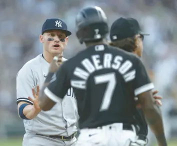  ?? CHRIS SWEDA / CHICAGO TRIBUNE ?? Yankees third baseman Josh Donaldson, left, and White Sox shortstop Tim Anderson share words in the first inning on May 13 at Guaranteed Rate Field.