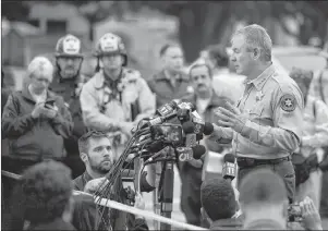  ?? AP PHOTO ?? Ventura County Sheriff Geoff Dean speaks to reporters near the scene in Thousand Oaks, Calif., on Thursday, where a gunman opened fire the previous night inside a country dance bar crowded with hundreds of people. Officials say the suspect is dead inside the bar.