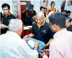  ??  ?? The Managing Director, Mr. Ananda Seneviratn­e accepts the first transactio­n of the Siyapatha Finance branch in Jaffna