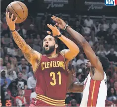  ??  ?? Cleveland Cavaliers guard Deron Williams (left) shoots the ball past Miami Heat guard Josh Richardson during the first half at American Airlines Arena.