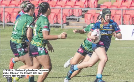  ?? ?? TOP RUN: Western Clydesdale­s Cheyenne Zirbel takes on the Ipswich Jets line. Picture: Nev Madsen.