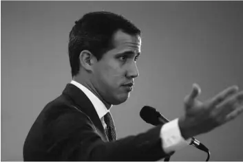  ??  ?? Venezuela’s National Assembly President and self proclaimed interim President Juan Guaido speaks during a press conference in Caracas, Venezuela, on Wednesday. AP PhoTo/leonArdo FernAndez