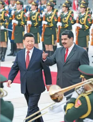  ?? FENG YONGBIN / CHINA DAILY ?? President Xi Jinping holds a welcoming ceremony for his Venezuelan counterpar­t, Nicolas Maduro, outside the Great Hall of the People in Beijing on Friday.