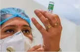  ?? (AFP) ?? A medical worker prepares to inoculate a colleague with a vaccine at a hospital in India’s capital New Delhi on Saturday