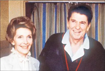  ?? MIKE EVENS/GETTY-AFP 1981 ?? President Ronald Reagan, seen with first lady Nancy Reagan, was shot and nearly killed by an assassin’s bullet less than three months into his first term. He would serve two terms.