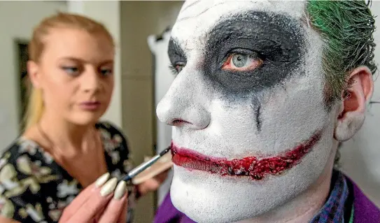  ?? PHOTO: RICKY WILSON/FAIRFAX NZ ?? Makeup artist Annah Sophia Stevenson works on Rhys Hummelstad’s makeup for Halloween.