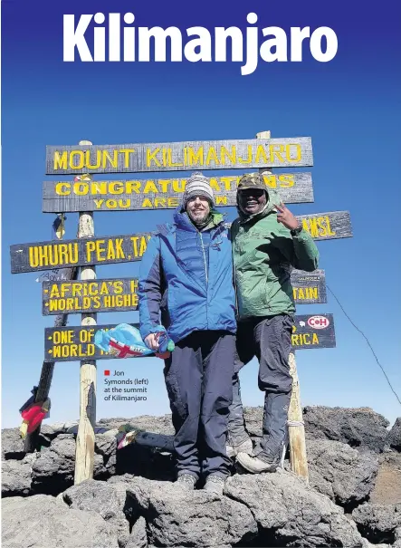  ??  ?? Jon Symonds (left) at the summit of Kilimanjar­o