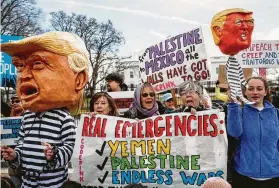  ?? Carolyn Kaster / Associated Press ?? People gather on Presidents Day in front of the White House to protest President Trump’s declaratio­n of a national emergency along the southern border.