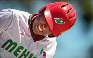  ??  ?? Mexico batter Josue Martinez grimaces as his side lost to Guatemala.