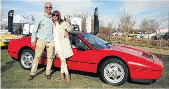  ??  ?? Zia and Glenn Wort in front of her winning 1989 Ferrari 328 GTS.