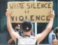  ?? Tyler Sizemore / Hearst Connecticu­t Media ?? Protesters gather on Aug. 9 outside the Stamford Police Department to demand officers be held accountabl­e for the death of Steven Barrier, who died while in Stamford police custody in October 2019.