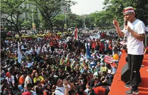  ?? — Suherdjoko/the Jakarta Post/asia news network ?? Ganjar is the top presidenti­al contender, surveys say. but can he run in 2024?