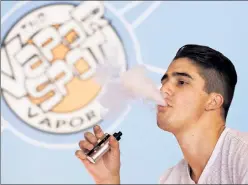  ??  ?? Up in smoke: E-cigarettes are helping smokers quit, but new federal rules treating them like tobacco products will make that harder.