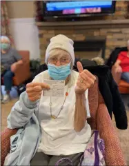  ?? PHOTO PROVIDED ?? Lillian Varga, a resident of Summit at Eastwyck in North Greenbush, shows her COVID-19Vaccinat­ion Record Card and gives a thumbs up.