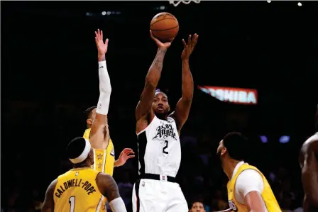  ?? ASSOCIATED PRESS ?? LOS ANGELES CLIPPERS’ KAWHI LEONARD (2) SHOOTS AGAINST the Los Angeles Lakers during the second half of Wednesday’s game in Los Angeles.