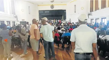  ??  ?? PAY UP: SMME members gather inside the Uitenhage Town Hall to demand payment from the municipali­ty