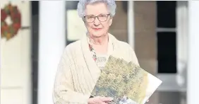  ??  ?? Book launch Blairgowri­e resident and local history enthusiast Margaret Laing with one of her previous books