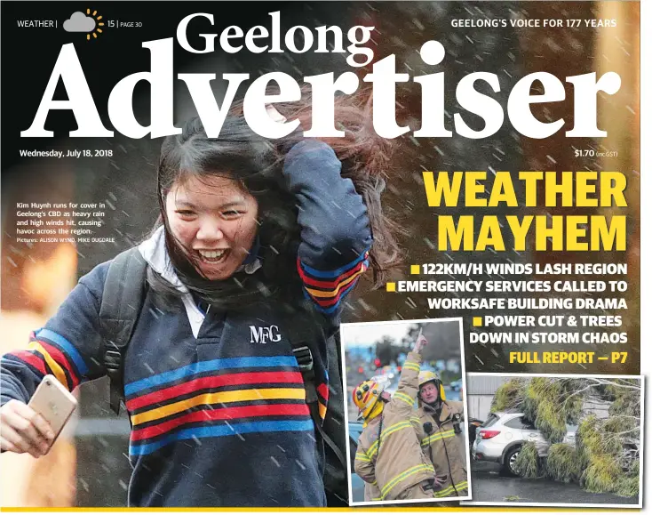  ?? Pictures: ALISON WYND, MIKE DUGDALE ?? Kim Huynh runs for cover in Geelong’s CBD as heavy rain and high winds hit, causing havoc across the region.