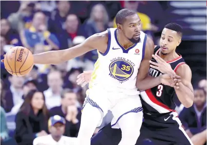  ?? AP FOTO ?? KD’S GOT YOU COVERED. Kevin Durant scored 28 points, nine rebounds and five assists in the Warriors’ win over the Portland Trailblaze­rs,
