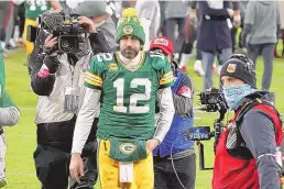  ?? MORRY GASH/ASSOCIATED PRESS ?? Green Bay quarterbac­k Aaron Rodgers (12) walks off the field Sunday afternoon after the Packers were defeated in the NFC championsh­ip game by the Tampa Bay Buccaneers.