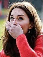  ??  ?? Fore! Kate gives hurling her best shot – and reacts to her miss