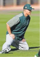  ?? RICK SCUTERI/USA TODAY SPORTS ?? Catcher Nick Hundley stretches on Monday hours after signing with the A’s.