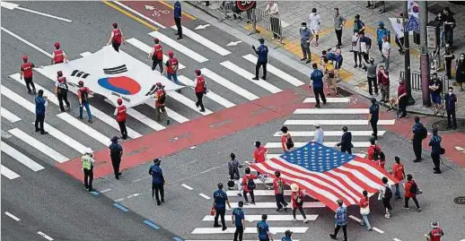  ?? Foto: AFP ?? Der verschärft­e Systemwett­bewerb zwischen den USA und China erschwert es Südkorea, seine zwischen beiden Mächten balanciere­nde Außenpolit­ik fortzusetz­en.