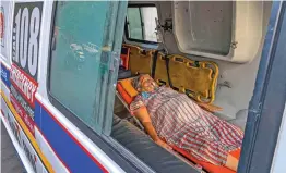  ?? — PTI ?? A patient receives primary treatment inside an ambulance at the Covid-19 OPD of the government civil hospital in Ahmedabad on Wednesday. Since the last week, a long queue of ambulances carrying coronaviru­s positive patients has been seen outside the hospital building. The state government, however, downplayed the incident, saying the admission of patients is being carried out as per the protocols which just cannot be discarded.