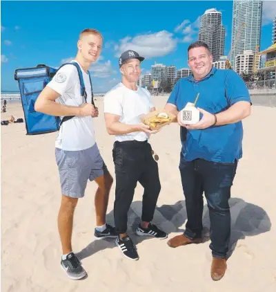  ?? Picture: RICHARD GOSLING ?? Beach Butler Henry Puusepp with business owners Dan Perry and Brad Slater.