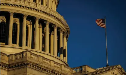  ?? Photograph: Samuel Corum/Getty Images ?? The sun rises over the US Capitol building in Washington.