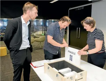  ??  ?? Above: National Library of New Zealand staff Mark Crookston and Peter Whitehead with Leeds University Library’s Dr Stella Butler unpack the New Zealand World War I diaries which have been held as part of the Liddle Collection in the United Kingdom since the 1970s.