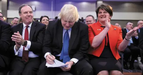  ??  ?? CONSEQUENC­ES: Nigel Dodds, Boris Johnson and Arlene Foster during the DUP annual conference in Belfast