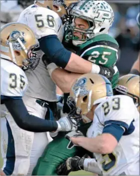  ?? For Montgomery Media / MARK C. PSORAS ?? Pennridge’s Mike Class is wrapped up by a host of Spring-Ford defenders during Saturday’s District One Class AAAA playoff game Saturday at Poppy Yoder Field.