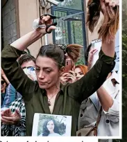  ?? ?? Outrage: An Iranian woman in Turkey hacks off hair in protest
