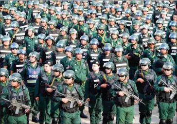  ?? TANG CHHIN SOTHY/AFP ?? Cambodian police officers stand in formation during an inspection ceremony at Olympic National stadium in Phnom Penh on Wednesday in preparatio­n for the July 29 national elections.