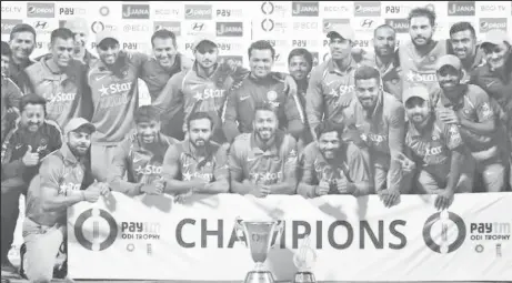  ??  ?? India lost yesterday’s final One Day cricket match but won the series. Above they are pictured with the One-Day series trophy. (Reuters photo)