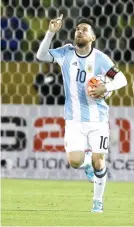  ?? (AP PHOTO/ FERNANDO VERGARA) ?? HAT TRICK. Argentina’s Lionel Messi, left, celebrates after scoring against Ecuador during their 2018 World Cup qualifying match.