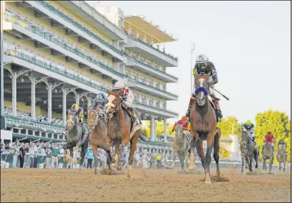  ?? Jeff Roberson The Associated Press ?? Authentic, right, was 10-1 odds to win the Kentucky Derby, but held off favorite Tiz the Law for the win.