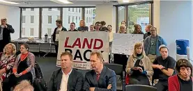  ??  ?? Protesters at a recent Wellington City Council meeting on the sale of land at Shelly Bay.