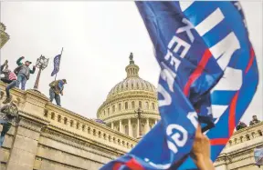  ?? NEW YORK TIMES FILE PHOTO ?? Supporters of President Donald Trump storm the U.S. Capitol on Jan. 6. Polls indicate only a small fraction of Americans approved of the riot, but experts fear the anger that drove it is more widespread and likely to persist.