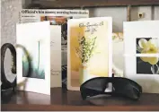 ??  ?? Sympathy cards rememberin­g Emma Patiño, who died after contractin­g the virus at Gateway, sit on a shelf at her grandson Jaime Patiño’s home.